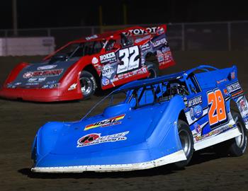 Dennis Erb Jr. races past Bobby Pierce at Davenport Speedway on May 17.