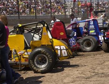 The cars of Chris Bonneau (78), Bobby Marcum (85) and Zach Sawyers (xxx) in the pit area