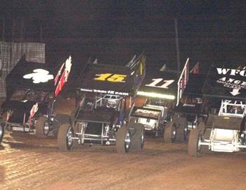 Jerry Bell, Sam Hafertepe, Jr., and Chris Sweeney lead the three-wide salute