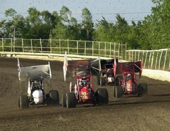 Rafe Essary (26), Joe Wood, Jr. (03) and Brett Thompson (80) chase Cody Branchcomb down the backstretch