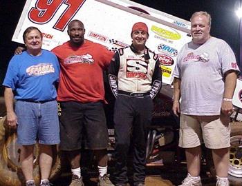 Darren Stewart captured the Speedweek crown.  Hes pictured here with Mike Stewart, Randy Moore and car owner Bobby Sparks.