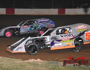 Austin (8a) battling Daulton Wilson (5) for the lead at County Line Raceway.