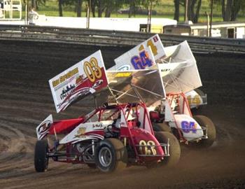 Joe Wood, Jr. (03), Johnny Miller (64J) and Robert Byrom (14b) charge through turns three and four