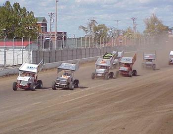 A pack of sprinters down the frontstretch