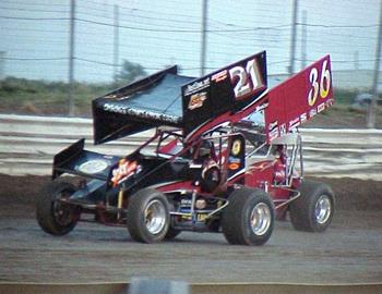 Brian Brown and Jason Martin race down the back stretch