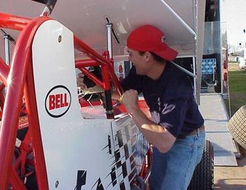 Photog Tim Aylwin mounts a cameron on Nick Smiths sprint car.