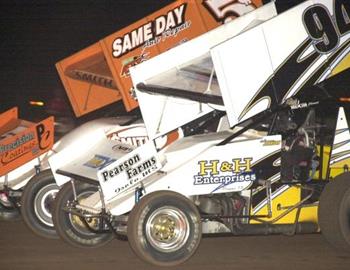 Wayne Johnson (94) and Danny Smith (5$) mix it up for the final transfer out of a B Main