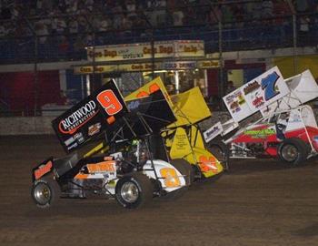 Gary Wright (9), Wayne Johnson (94) and Kevin Ramey (7m) lead the three-wide salute