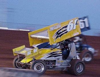 Lee Jennings (61L) races underneath grandfather Earnest Jennings (61)