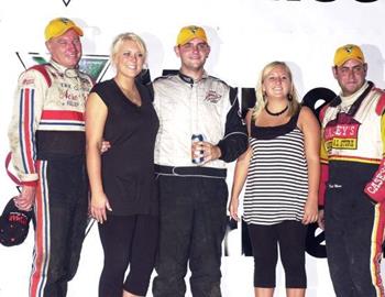 The Thursday night podium included winner Kaley Gharst (center), runner-up Gary Wright (left) and Matt Moro