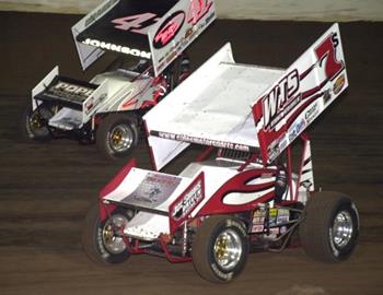 Jason Sides (7s) and Jason Johnson (41) race for position in the feature