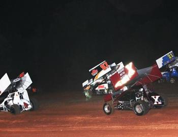 The pack races off turn two in the feature