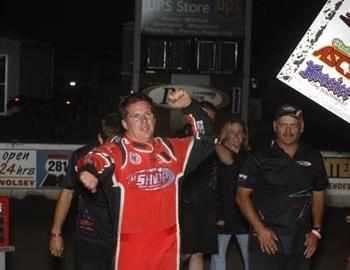 Jason Johnson celebrates his victory at Hurons Dakota State Fair Speedway