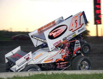 Jason Johnson (41) and Foster Landon (11F) race for the lead in heat race action