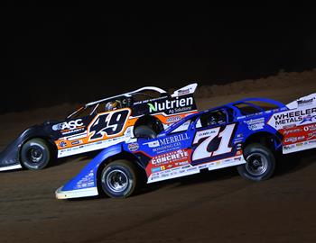 Jonathan Davenport (49) and Hudson ONeal (71) battle at Spoon River Speedway on May 7, 2025