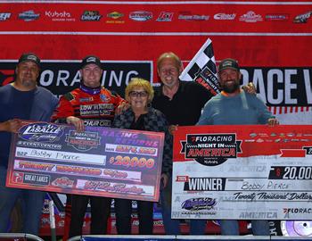 Bobby Pierce and father Bob Pierce are joined by (left to right) promoters Tony Izzo Jr., Kerry Izzo and Justin McCoy. Bobby Pierce earned $20,000 in May 6s FloRacing Night in America presented by Kubota opener at La Salle (Ill.) Speedway.
