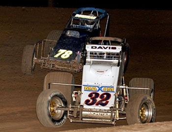 Charles Davis, Jr. (32) races with Chris Bonneau for the lead