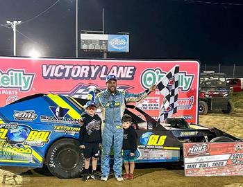 Kyle in Victory Lane with his sons on Sunday, May 21 at Adams County Speedway.