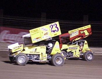 Jimmy Taylor (23) and D.J. Masner (d1) in heat race action