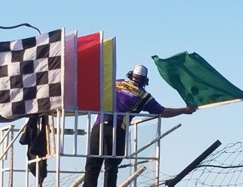 Nathan Peterson waves the green for the field at Park Jefferson Speedways South Dakota Sprint Car Nationals.