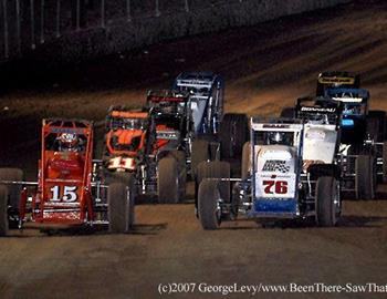 Mike Leslie (76) and R.J. Johnson (15) lead the way