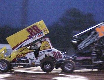 Mike Ward (88) and Pete Butler (29h) get together in heat race action