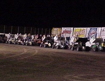 Field in three-wide formation down the backstretch