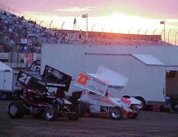 The sun sets as Brian Brown (21) and Chad Humston (23c) get ready to hot lap.