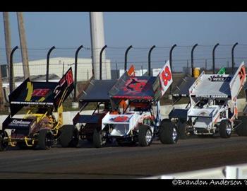 Jack Dover (53) and Ryan Roberts (18) pace the field