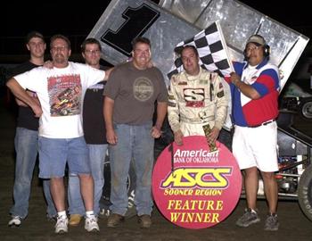 Sean McClelland and company in victory lane at Creek County