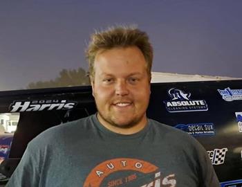 Cody Thompson with his car in the pit area.