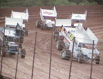 Sam Hafertepe, Jr., and Jan Howard lead the way off turn four