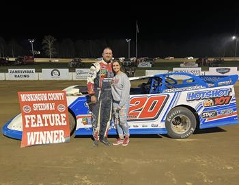 Todd Brennan celebrates with a hug after his win at Muskingum County Speedway on Saturday, April 27.