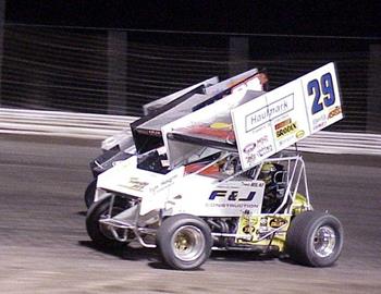 Travis RIlat races inside Steven Tiner and another car