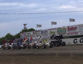 A heat race rolls down the backstretch at Cowtown 