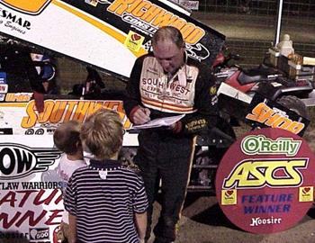 Gary Wright signs autographs for some young fans after ASCS National Tour win number 98