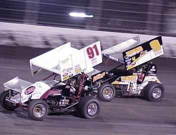 Darren Stewart (91) and Gary Wright (9) race in the feature