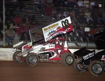 Joe Wood, Jr. (03) squeezes around Jason Botsford (29a) in the final laps of the feature
