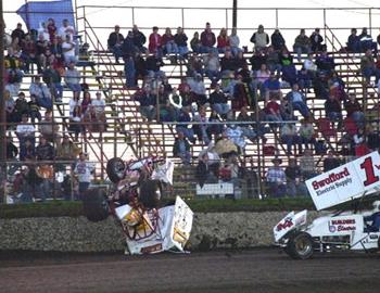 Garry Lee Maier tumbles down the frontstretch in his heat race