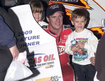 Jason Johnson in victory lane with some young fans