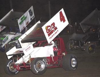 Jamie Passmore (4), Gary Taylor (5*) and Sean McClelland (1) battle in the feature