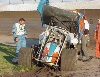 Steven King surveys the damage to his racer after a heat race flip