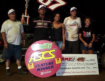 Tim Crawley takes the trophy and the check from 67 Texarkana Speedway