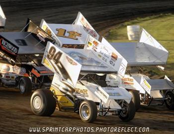 Chad Meyer and Wayne Johnson lead a heat race start at Huron