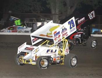 Travis Rilat (29) and Brian McClelland (87) race for the lead in the feature