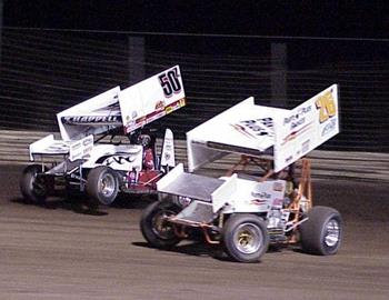 Zach Chappell lifts the front end while racing outside of Marshall Skinner