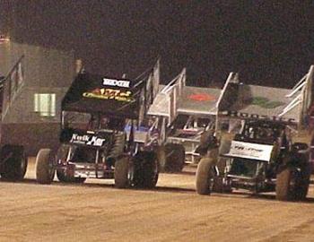 Cody Branchcomb, Tony Bruce, Jr., and Sean McClelland lead the three-wide salute prior to the feature.