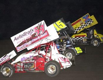 Gordy Vogelaar (99v),Sam Hafertepe, Jr. (15) and Chuck Swenson (X)  lead the three-wide