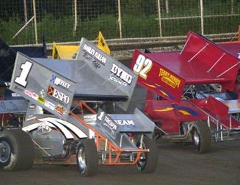 Sean McClelland (1) and Mike Goodman (92) lead the pack off turn four