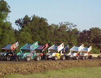 Heat race lines up down the back stretch